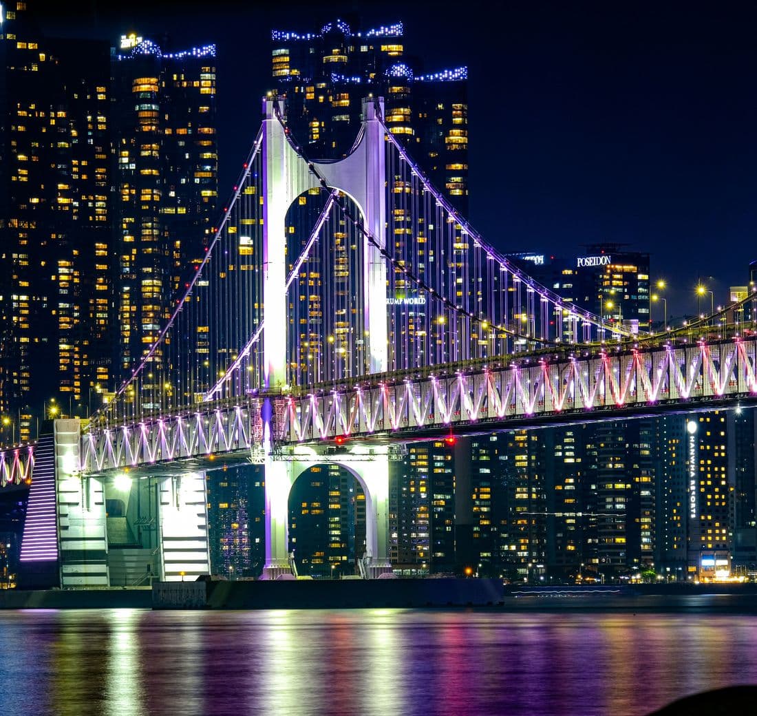 Gwangandaegyo Bridge lit up at night in Busan